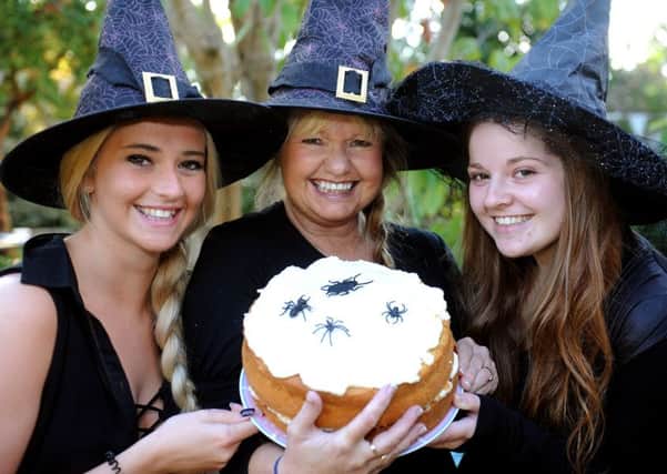 Halloween fun at Borde Hill Gardens, Haywards Heath. Owner Kerrie Holman at Little Ritz Tea Room, with her witch helpers. Pic Steve Robards  SR1631313 SUS-161023-123521001