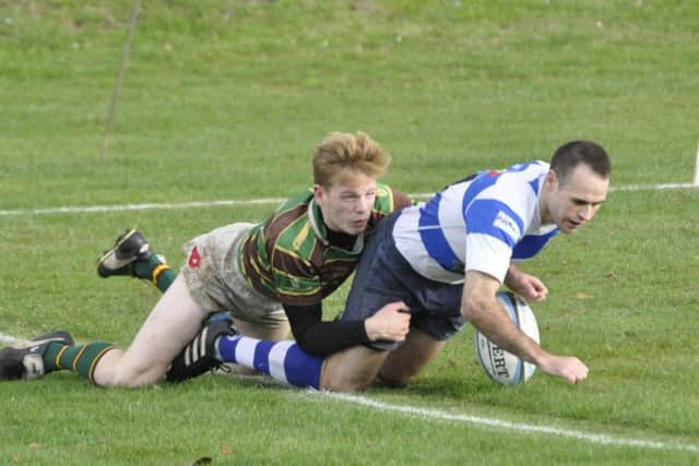 Jake Stinson is tackled by a Brockleians opponent. Picture courtesy Nigel Baker