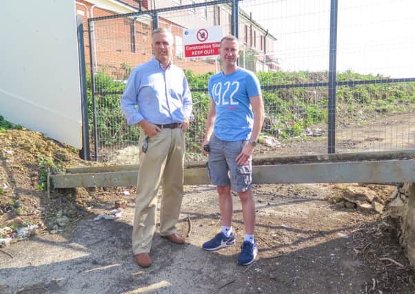 Cllrs Andy Patmore and Matthew Beaver by the site in West Hill Road. Picture by Graeme Williams