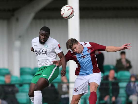 Sam Cruttwell goes up for a header during Saturday's win over Whyteleafe. Picture courtesy Scott White