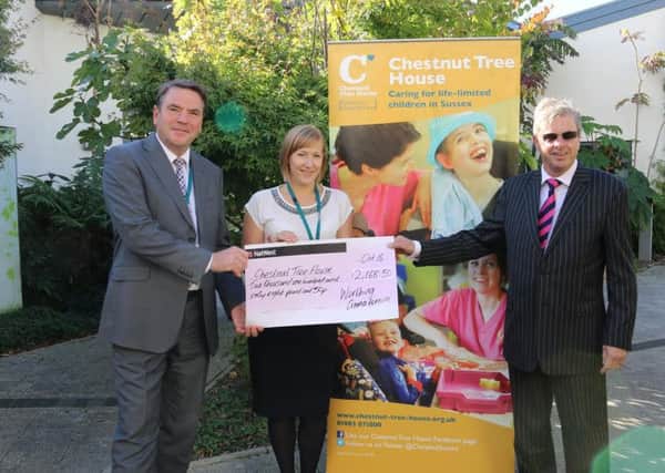 Hugh Lowson (Chief Executive, St Barnabas House Hospice), Vicky Norman (Chief Corporate Fundraiser, Chestnut Tree House Children's Hospice) and Councillor Clive Roberts with a cheque for Â£2,168.50