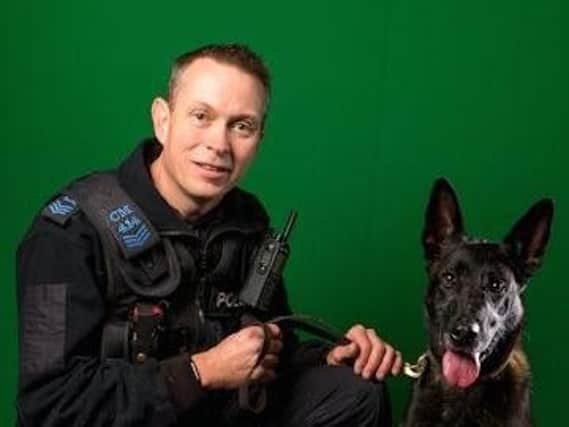 Sergeant Graeme McKee with police dog Blyss
