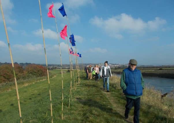 Pink and blue flags mark the Route A road crossing point