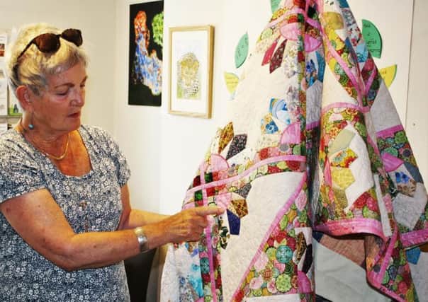 Patricia McLaughlin with her quilt