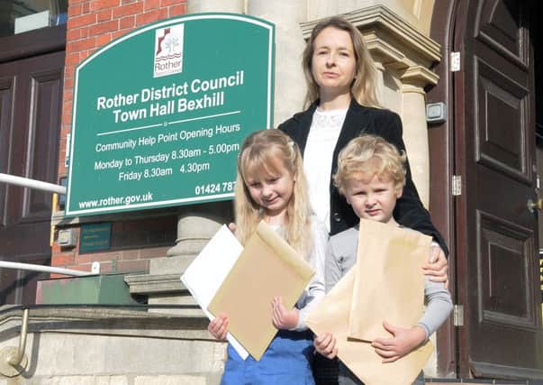 Helen Eckersley handed the petition to Rother District Council with her children Lily and Daniel. Photo by James Eckersley SUS-161027-132845001