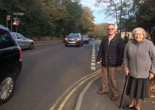 Cllr Clarke with a concerned resident by the road
