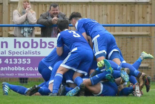 Heath players celebrate the late goal. Picture by Grahame Lehkyj