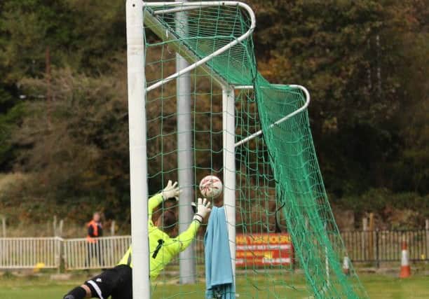 The Aylesbury United goalkeeper is beaten for the third Hastings goal on Saturday. Picture courtesy Scott White