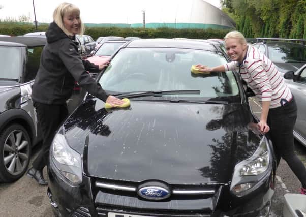 Crawley-based UK Power Networks employees, Mel Oakley and Harriet Tidey, ran a sponsored car wash for Stand Up To Cancer - submitted