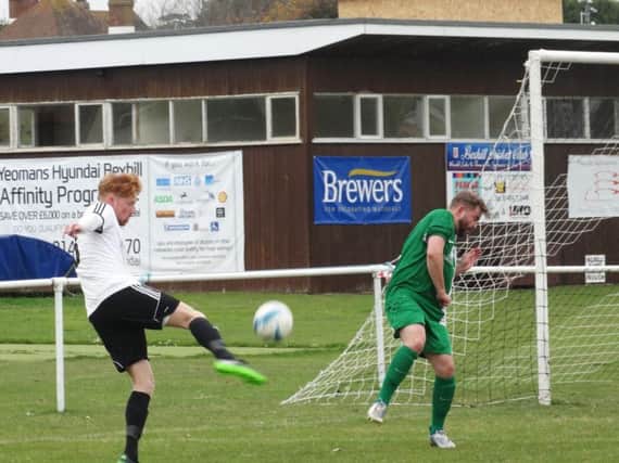 Wayne Giles has a shot at goal for Bexhill United against Mile Oak. Picture courtesy Mark Killy