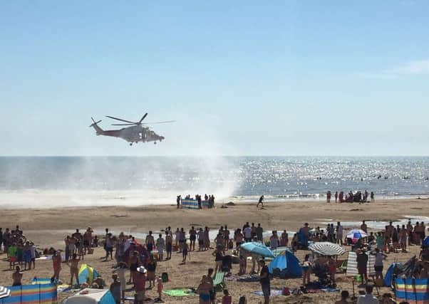 The air ambulance at Camber Sands when five friends got into difficulty in the sea and died