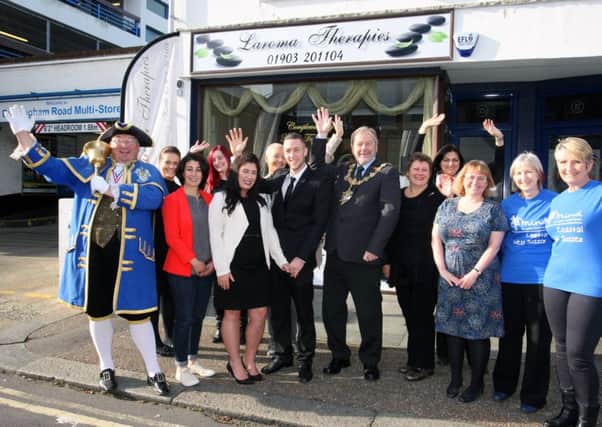 Lauren Vaughan, centre, with the mayor of Worthing Sean McDonald and town crier Bob Smytherman. They are seeking donors for a charity raffle which will raise money for Coastal West Sussex Mind.