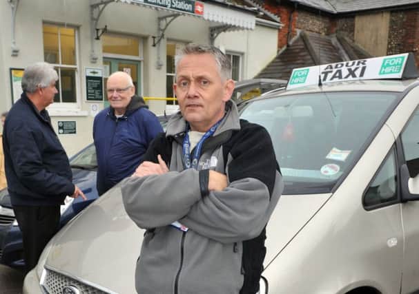 W51374H13-TaxiFares

Adur hackney carriage drivers fare issue. Neighbouring taxi companies want to raise the price of taxi fares. Pictured is Adur driver, Sean Ridley, who wants the fares to remain the same. Lancing. ENGSUS00120131217141303