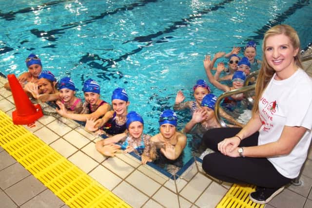 Rebecca Adlington is pictured with some young swimmers