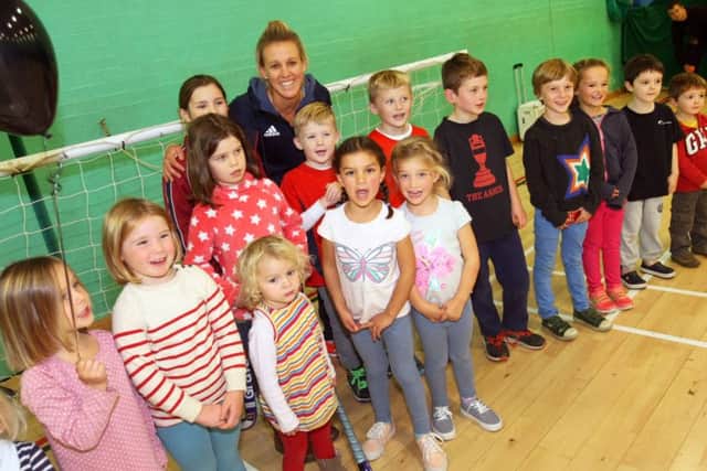 Alex Danson is pictured with some young fans