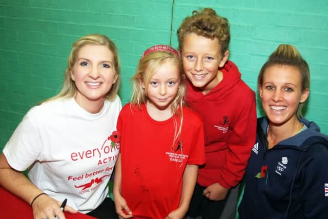 Olympians Rebecca Adlington and Alex Danson with Joshua O'Leary, 13 and his sister Isabelle, nine