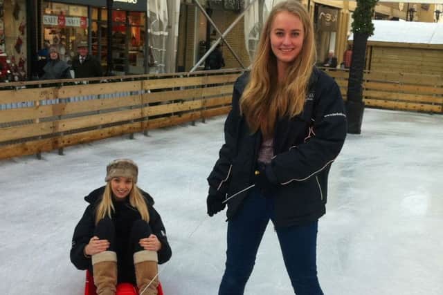 Carlie Stace (seated) and fellow T Ice staff member Hannah Palmer at the Priory Meadow ice rink SUS-160811-094634001