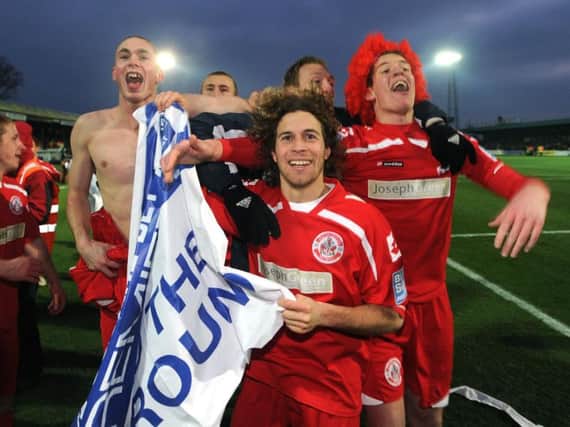 Crawley Town players celebrate after another win on their incredible FA Cup run