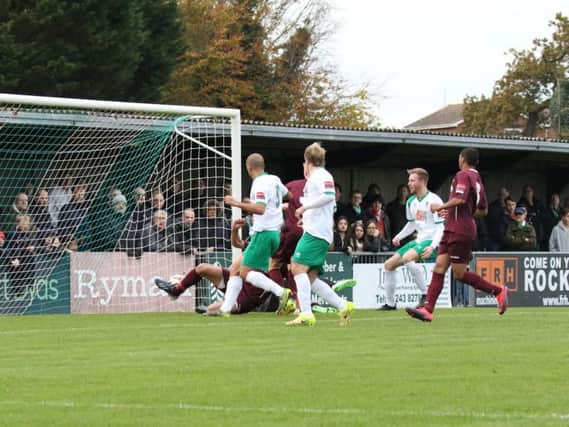 Ollie Pearce's free kick goes in to open the scoring - Picture by Tim Hale