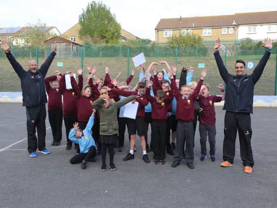 Chance to Shine coaches with children from City Academy Whitehawk in Brighton celebrating the news of further investment in primary schools