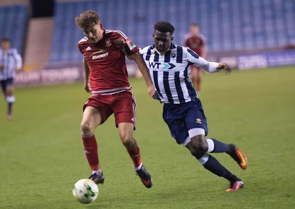 Worthing striker Luke Brodie in action at Millwall. Picture by Marcus Hoare