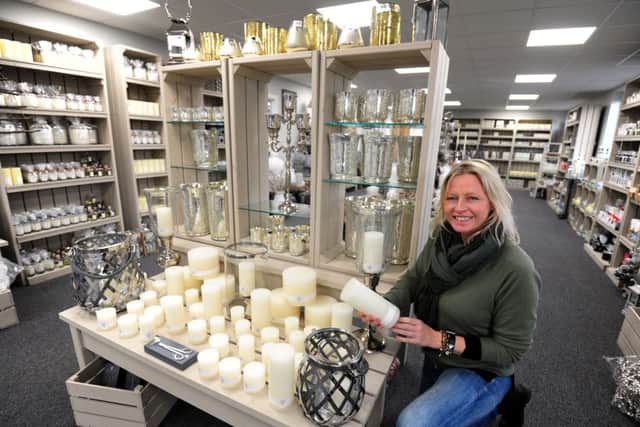 ks16001178-1 Chi Candle Shop Open  phot kate Clare Mulholland, assistant, in the new Contract Candles shop..ks16001178-1 SUS-160711-170518008