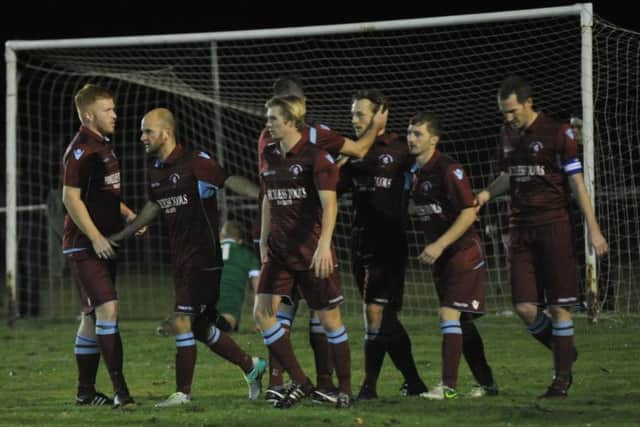 Common celebrate their match-clinching third goal. Picture by Simon Newstead