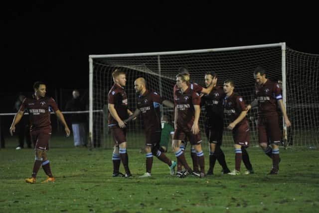 Little Common celebrate one of their goals. Picture by Simon Newstead