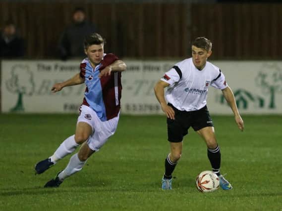 Sam Cruttwell closes down an opponent during Hastings United's game away to Faversham Town on Tuesday. Picture courtesy Scott White