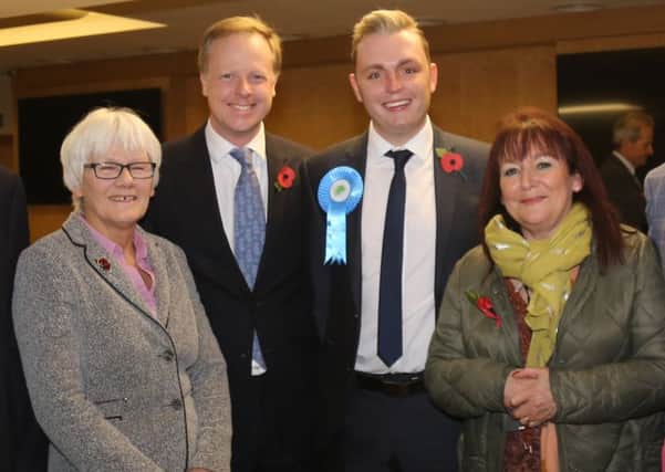 Billy Greening new Southwater councillor centre with rosette along with his new Conservative colleagues at Horsham District Council, L-R  Toni Bradnum (Nuthurst), Christian Mitchell (Holbrook West), Claire Vickers (Southwater), SUS-161111-091437001