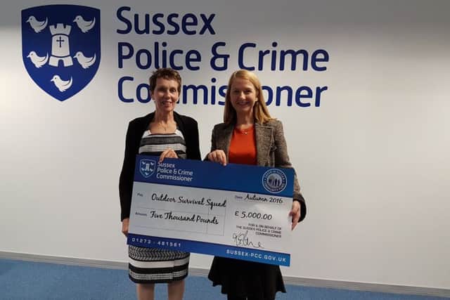 Carole Dixon, chief executive of Hastings Education Futures Trust with Sussex Police and Crime Commissioner Katy Bourne, donating money for an outdoor survival squad project. SUS-161111-094126001