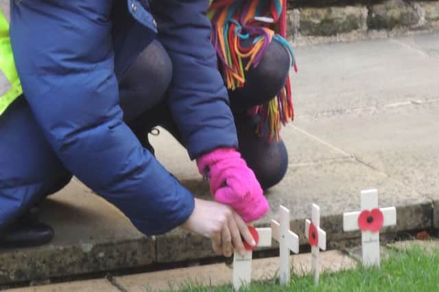 Pupils placed crosses at the memorial