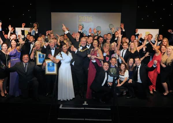 Winners celebrating at the awards ceremony last night (November 11). Picture: Jon Rigby