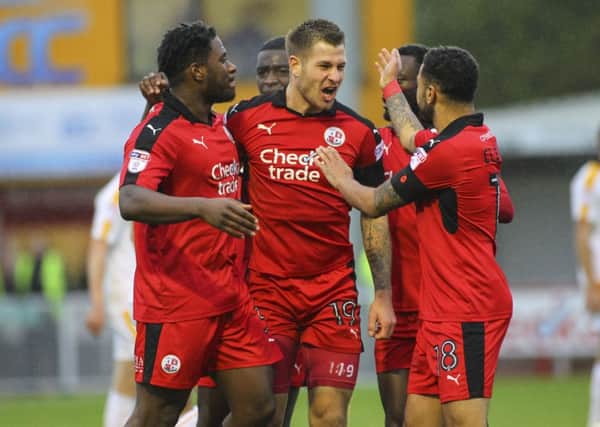 James Collins celebrates after getting Crawley Town's opener against Cambridge United. Picture by Jack Beard