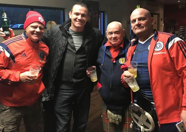Steve Herbert with three Scottish fans who watched Crawley Town v Cambridge Utd at the Checkatrade Stadium on Saturday SUS-161113-121651002