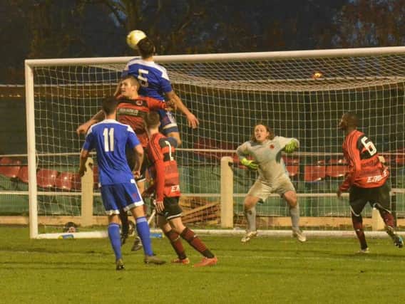 Nathan Cooper heads towards goal. Bedfont Sports v Haywards Heath Town. Picture by Grahame Lehkyj
