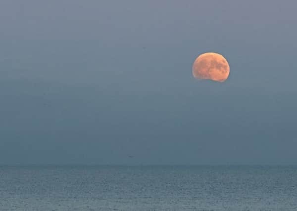 Reader Ian White sent us this photo of the Supermoon from last (Sunday) night