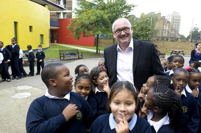 Sir Greg Martin with children at the Lambeth Academy