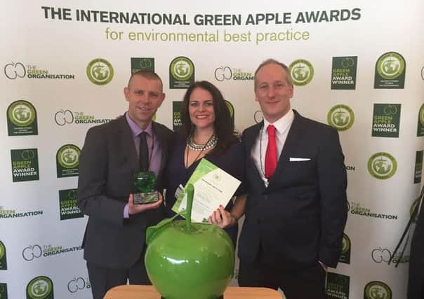 Peterhouse staff collect its National Environment Award. L-R: Rob Sands, Sara Whalley and Dan Piddlesden. SUS-161115-092246001
