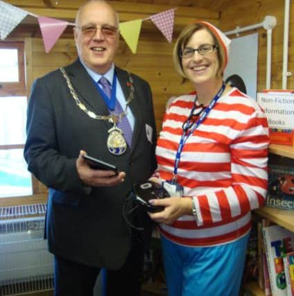 Burstow Primary School pupils and staff dress up as book characters as Horley town mayor Mike George opens their new library, The Pavilion. English Lead Rosemary Coleman with Cllr George - submitted