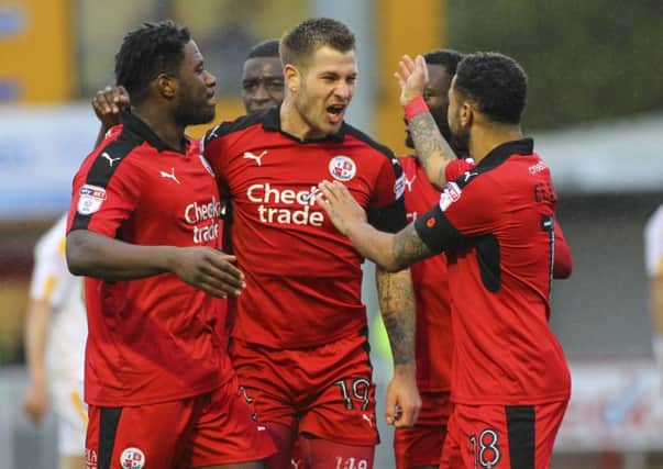 James Collins celebrates with his Crawley Town team-mates. Picture by Jack Beard