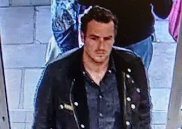 A CCTV image released by Sussex Police of a man officers want to speak to