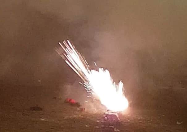 Ollie Griffen lies on the ground after a firework went off in his face in Ely, Cambs. Photo courtesy of SWNS. SUS-161115-135358001