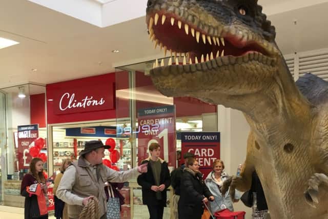 Children and adults alike were dwarfed by REX the toy dinosaur