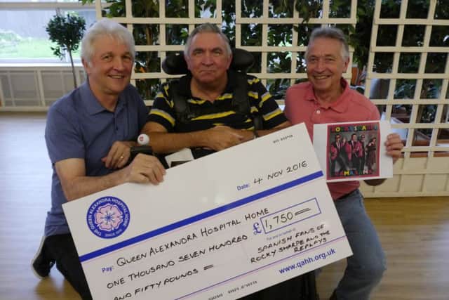 Jan, Rob and Eddie Podsiadly with the cheque from the Spanish concert