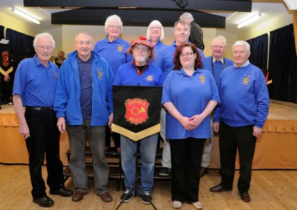 Members of the Rye and District Lions Club at the Beckley Village Centre Brass Band Concert in January 2013. Picture by Tony Coombes Photography