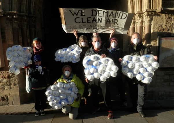Residents with the petition on protective masks outside the town hall