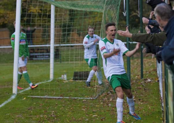 Jimmy Muitt celebrates his opener with the Rocks fans at Leatherhead / Picture by Tommy McMillan
