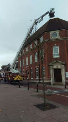 Firefighters repairing the post office roof