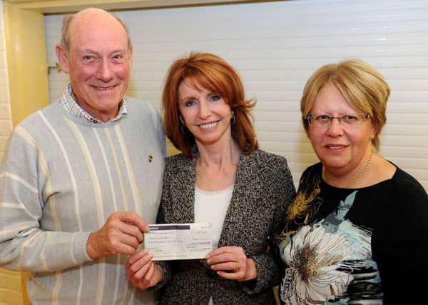 Uckfield Lion Chris Macve presents a cheque to Parkinson's UK President Jane Asher along with Sue Blunden, Chairman Mid Sussex branch Parkinson's UK.  Pic Steve Robards SR1634329 SUS-161120-150314001